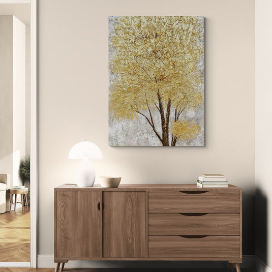 Cuadro de arte de árbol estilizado con follaje dorado.