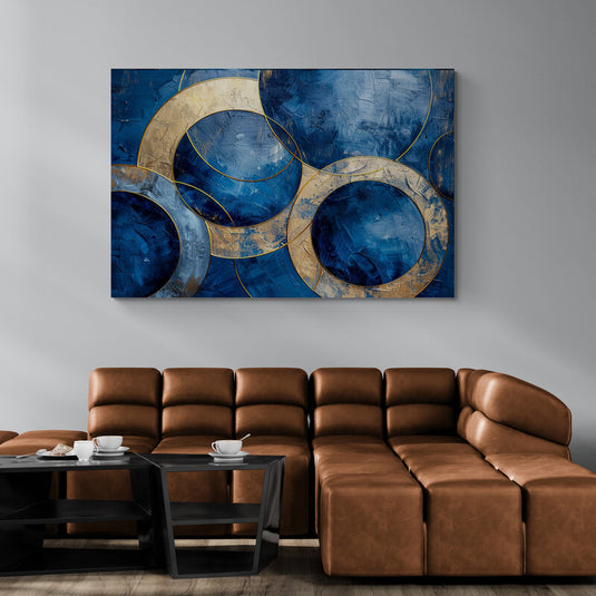 Pintura abstracta de círculos dorados sobre fondo azul