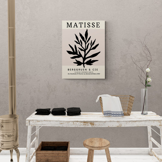 Cuadro decorativo con fondo beige, título 'MATISSE', detalle de ramita negra y texto 'BERGGUEN & CIE 70, RUE DE L'UNIVERSITE, PARIS VII DU VENDREDI 27 FÉVRIER AU SAMEDI 28 MARS 1953'.