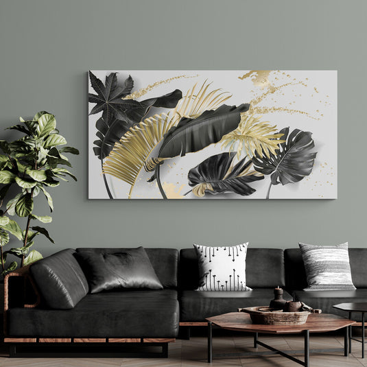Cuadro decorativo de hojas tropicales en tonos negro y dorado con diseño botánico moderno y elegante