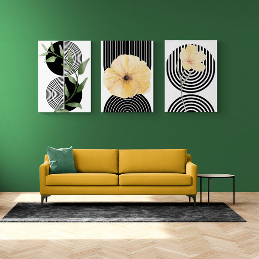 Set de cuadros decorativos modernos – Composición de flores y hojas sobre fondo geométrico en blanco y negro, con acentos amarillos y verdes en sala contemporánea.