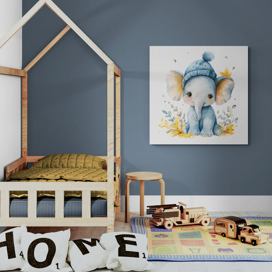 Ilustración en acuarela de un elefantito bebé con gorro azul rodeado de flores amarillas y hojas grises.