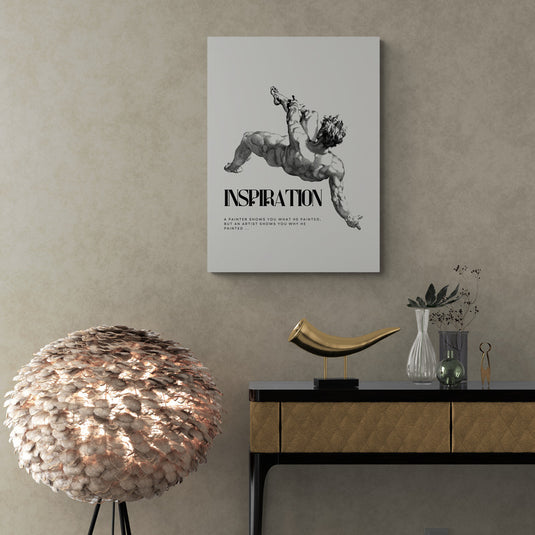 Lienzo blanco y negro con figura clásica y la palabra "Inspiration"