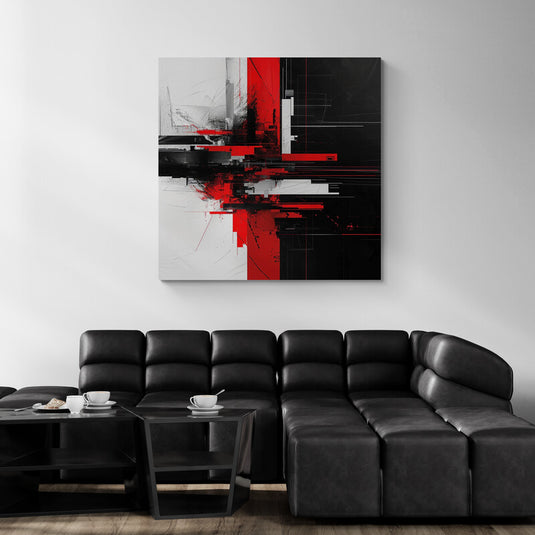 Cuadro abstracto rojo y negro en salón con sofá de cuero negro