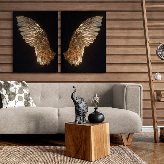 Cuadro decorativo de alas doradas en relieve sobre fondo negro, arte moderno y elegante para interiores sofisticados.