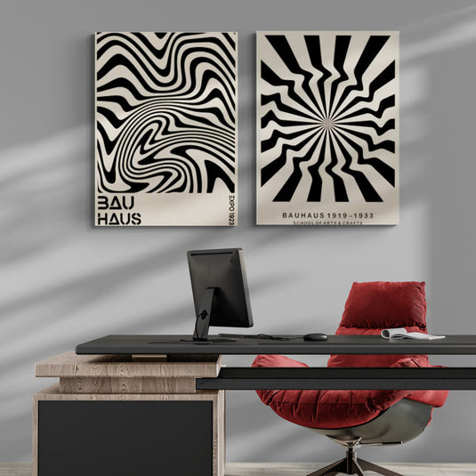 Cuadros Bauhaus en blanco y negro con patrones geométricos dinámicos en un espacio de oficina elegante con accesorios rojos.