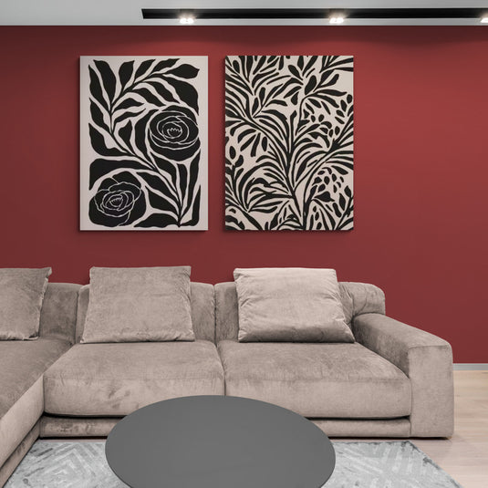 Set de cuadros decorativos con siluetas de flores y hojas en negro sobre fondo beige, ideal para decoración moderna en salas de estar.