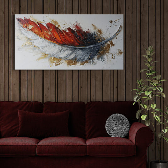 Cuadro decorativo con pluma abstracta en colores cálidos sobre sofá rojo en ambiente interior con estilo