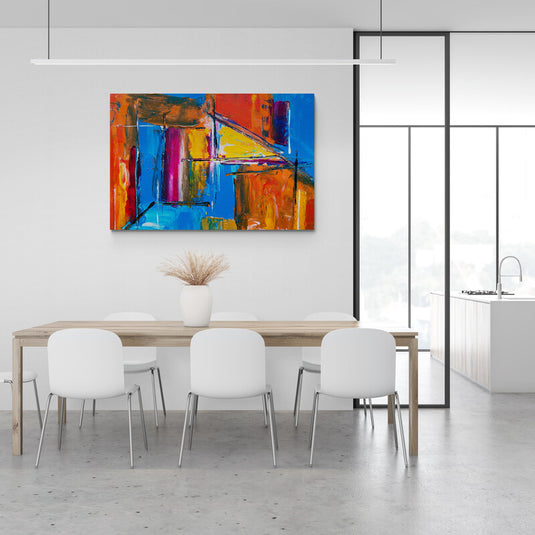 Cuadro abstracto con formas geométricas y tonos vibrantes en azul, naranja, rojo y amarillo.