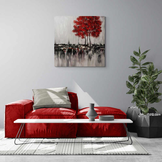 Árbol de hojas rojas sobre fondo gris con texturas negras en cuadro decorativo