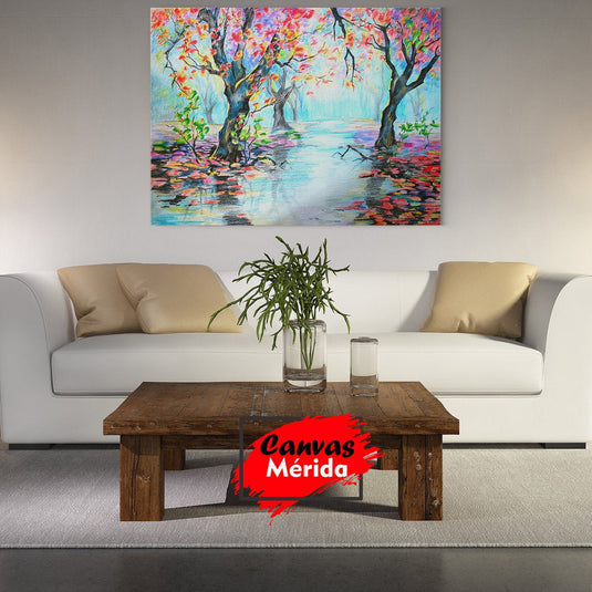 Cuadro decorativo de árboles con troncos robustos y hojas en tonos rosa, naranja y verde, con posible lago reflejante en el centro.