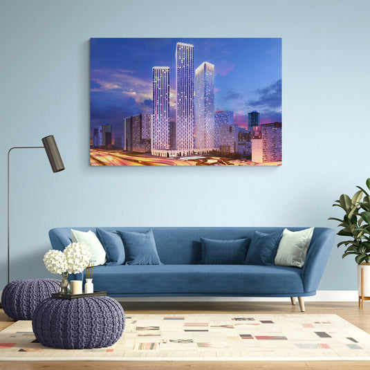 Cuadro decorativo de ciudad moderna con rascacielos iluminados al atardecer