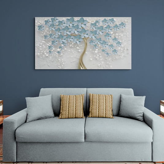 Cuadro decorativo de árbol con tronco dorado y ramas en forma de flores azules y blancas sobre fondo gris
