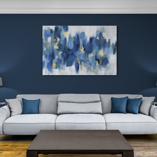 Pintura abstracta en tonos azules con acentos dorados