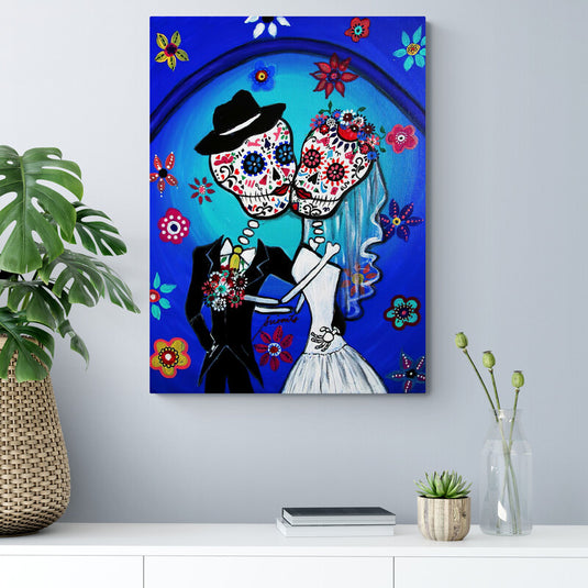 Pintura de pareja de esqueletos danzando, estilo Día de Muertos con flores coloridas