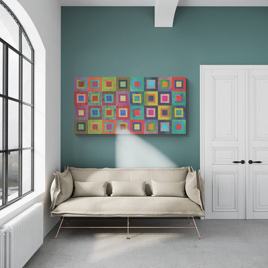 Cuadro geométrico: recuadros anidados en vibrantes tonos de naranja, fucsia, turquesa, verde y rojo