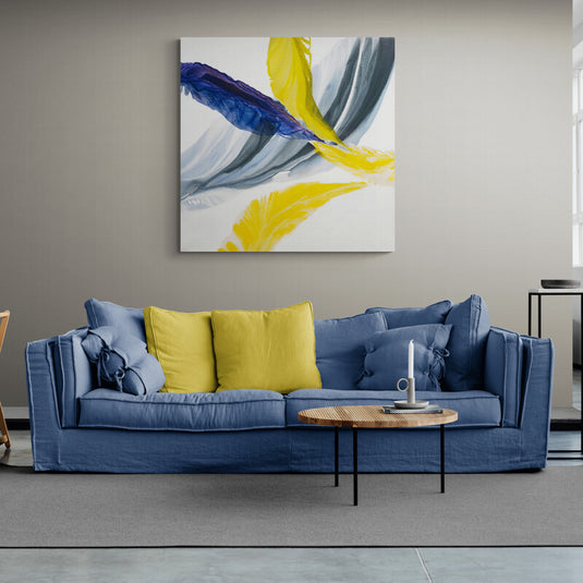 Cuadro abstracto con trazos fluidos en amarillo, azul y gris sobre fondo blanco