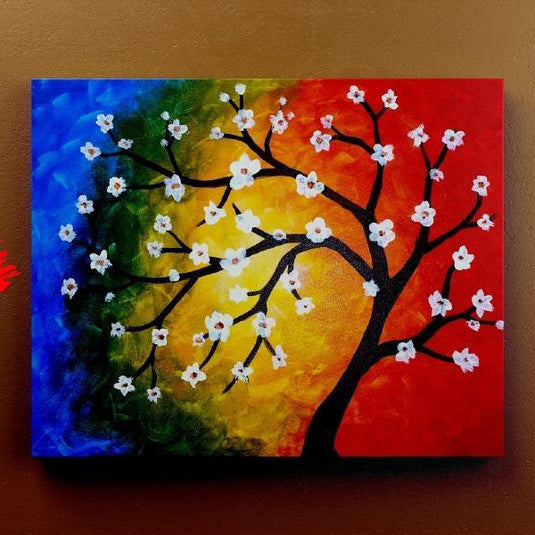 Cuadro_decorativo_fondo_multicolor_azul_verde_amarillo_naranja_rojo_arbol_negro_flores_blancas