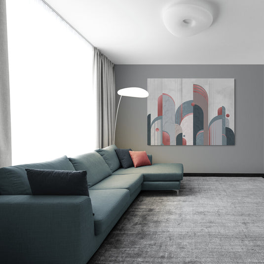 Cuadro decorativo en fondo gris claro, destacando estructuras minimalistas en variadas tonalidades grises y acentos en rosa o rojo.