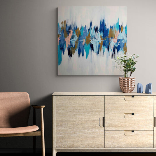 Arte abstracto en tonos azules, dorados y rosados