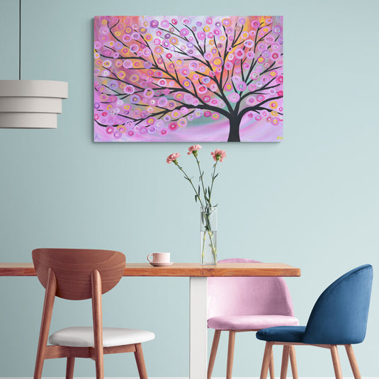 Cuadro_decorativo_con_fondo_rosa_y_árbol_grande_de_hojas_multicolores_en_forma_de_círculos