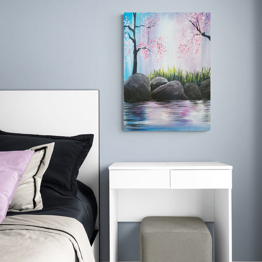 Cuadro Decorativo de Paisaje Natural con Piedras Grandes en la Orilla de un Lago, Árboles Altos con Hojas Rosadas y Fondo en Tonos Blanco, Rosa y Azul