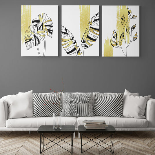 Tríptico Tropical con Hojas Monocromáticas y Detalles Dorados
