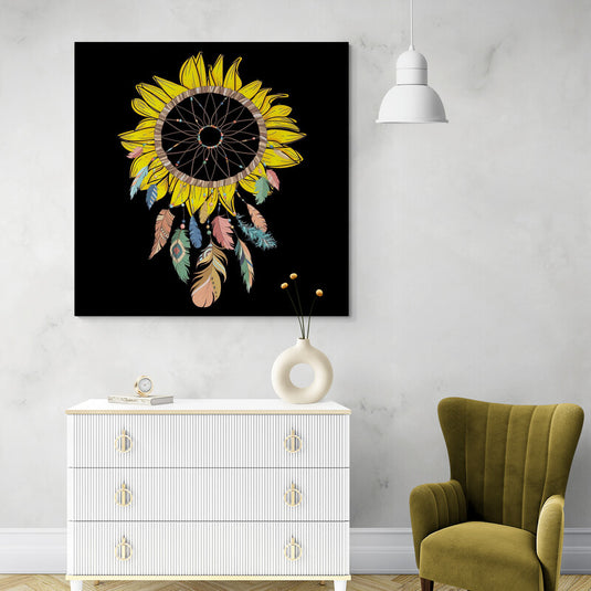 Atrapasueños sobre fondo negro con hojas amarillas, flor central tejida y plumas en tonos azul, verde, rosa y beige