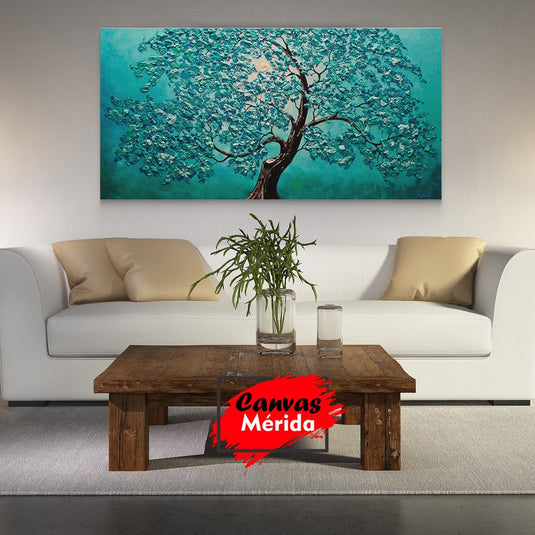 Cuadro decorativo de árbol con tronco café y pétalos turquesa sobre fondo turquesa