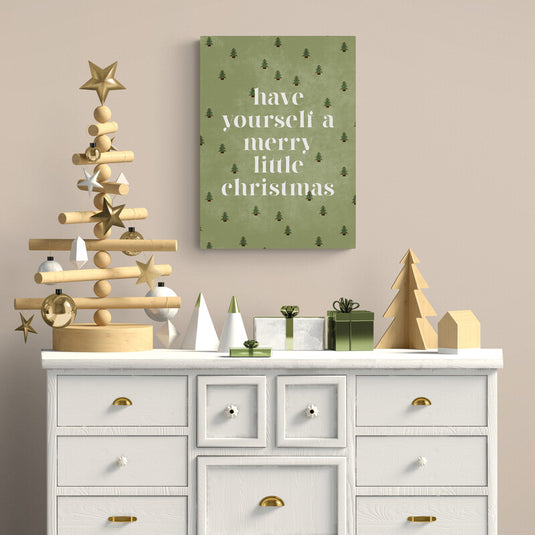 Lienzo de navidad con pinos y frase inspiradora en fondo verde oliva