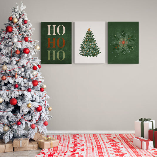 Set de tres lienzos navideños con 'HO HO HO', árbol adornado y copo de nieve