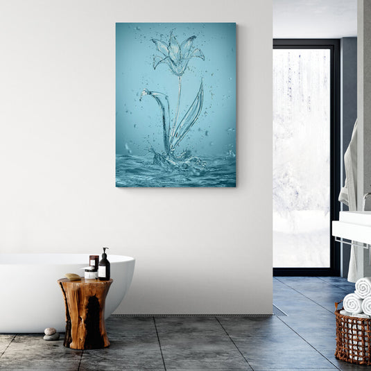 Cuadro decorativo con fondo azul mostrando charquito de agua formando una flor a través de salpicaduras.