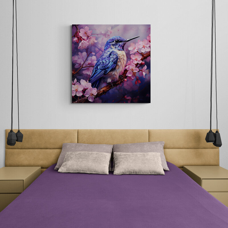 Colibrí azul detallado posado en rama con flores de cerezo en tonos rosas
