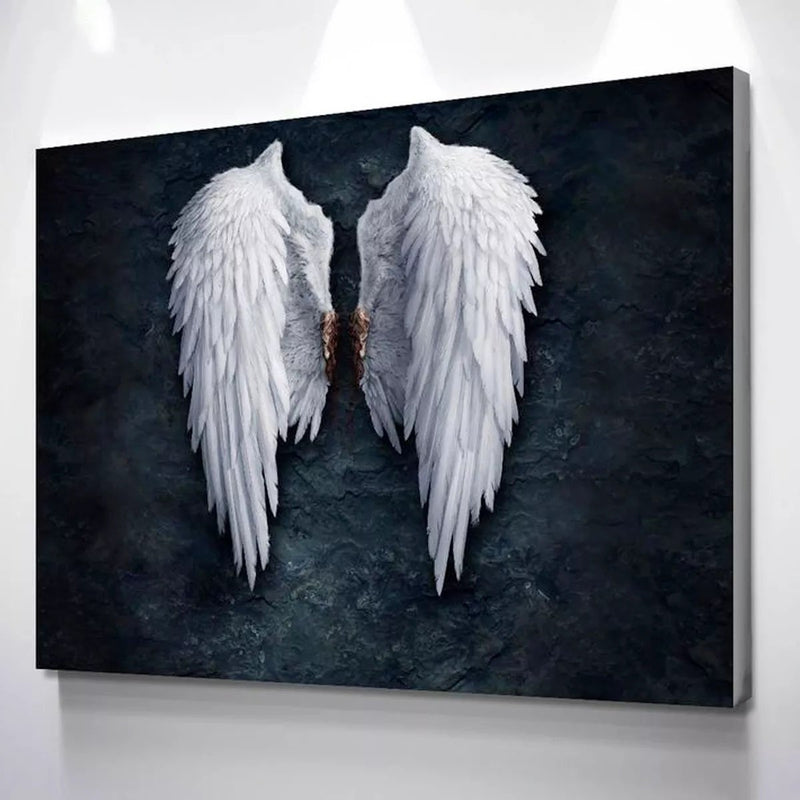 Alas blancas de ángel sobre fondo oscuro en cuadro decorativo