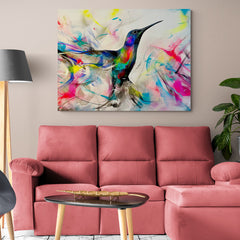 Cuadro decorativo con colibrí multicolor sobre fondo crema y líneas vibrantes en rosa, fucsia, amarillo, azules, verdes, rojo y negro