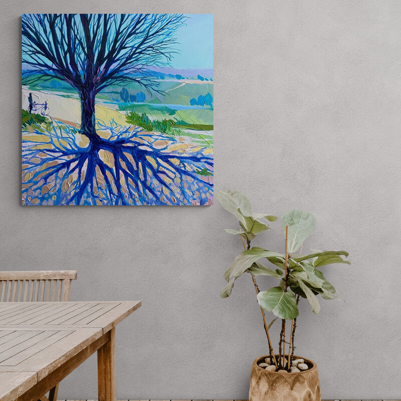 Cuadro decorativo de paisaje con árbol grande sin hojas y raíces azules.