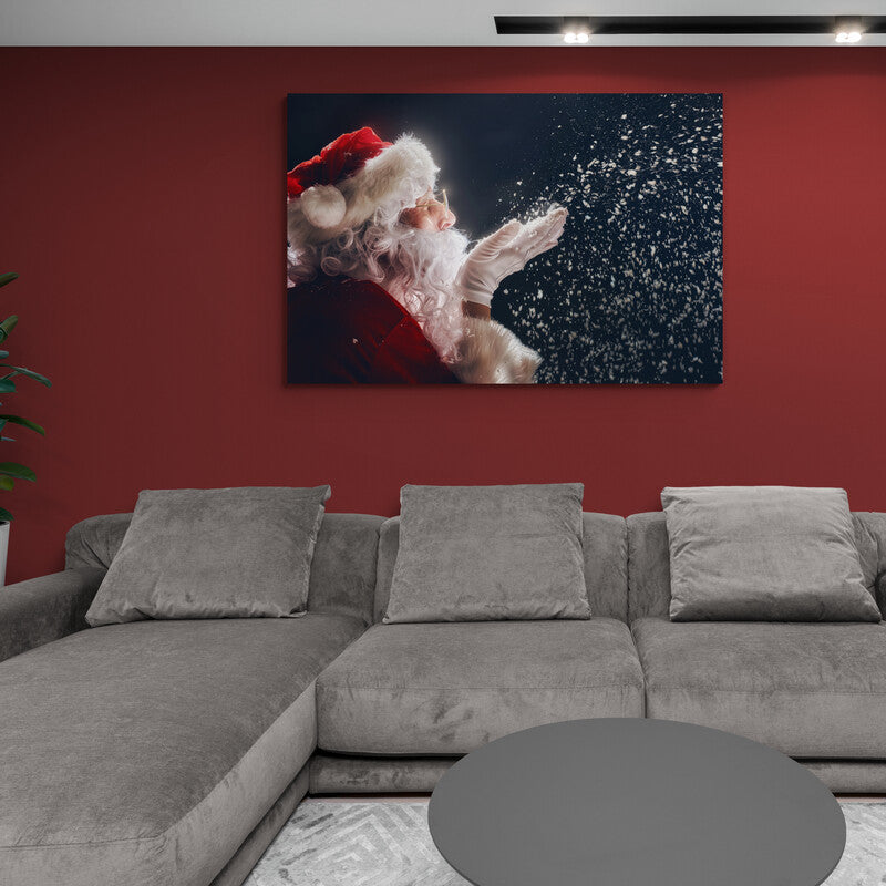 Santa Claus soplando nieve con un fondo oscuro
