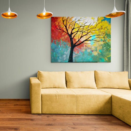Cuadro decorativo con fondo de colores combinados: turquesa, rojo, amarillo, verde y azul, y árbol sin hojas en el centro.