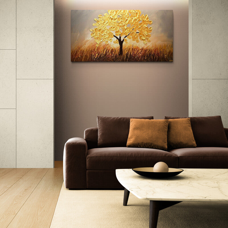 Cuadro decorativo con árbol de hojas amarillo brillante sobre fondo gris y suelo que evoca trigo.
