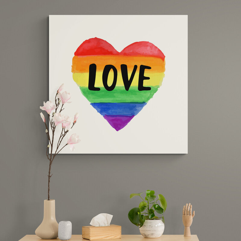 Pintura de corazón con colores del arcoíris y la palabra amor