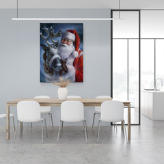 Pintura de Santa Claus con un reno en una noche nevada de Navidad.