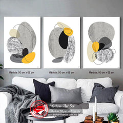 Set de cuadros decorativos con fondo blanco: figuras en forma de piedra en tonos grises, negro y amarillo, acompañadas de línea sutil negra