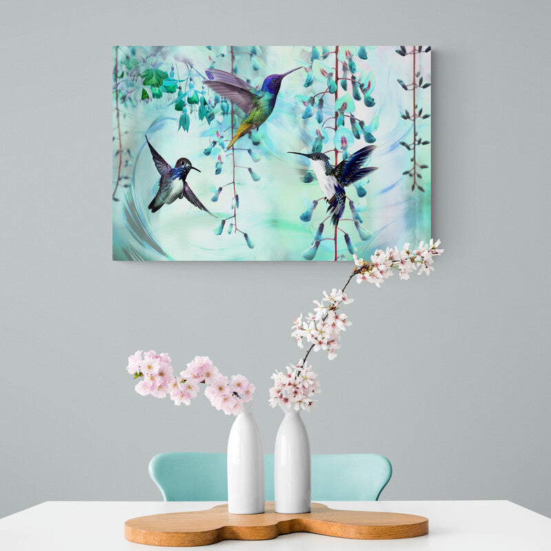 Tres colibríes en vuelo entre julianas floridas sobre fondo turquesa y blanco en cuadro decorativo.