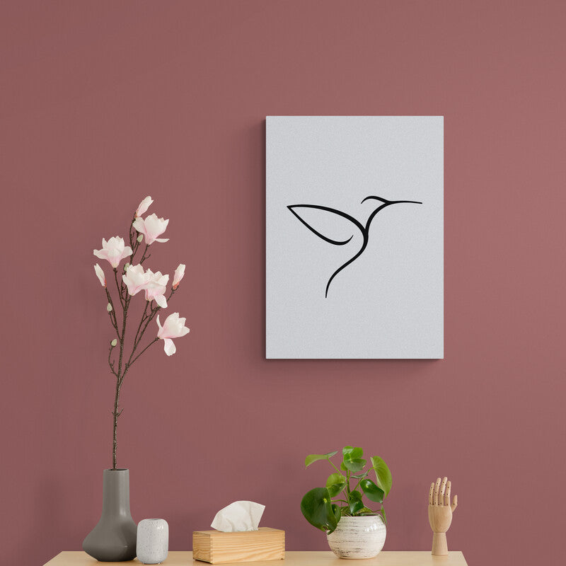 Silueta minimalista de colibrí en línea negra sobre fondo negro en cuadro decorativo